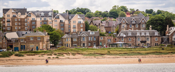 A view of North Berwick, Lothian, taken from the sea and shows the beach and grand family homes on the shoreline.